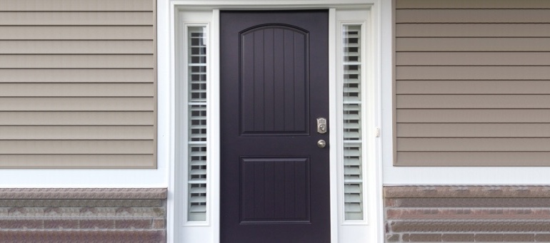 Sidelight Shutters On Black Door In Southern California
